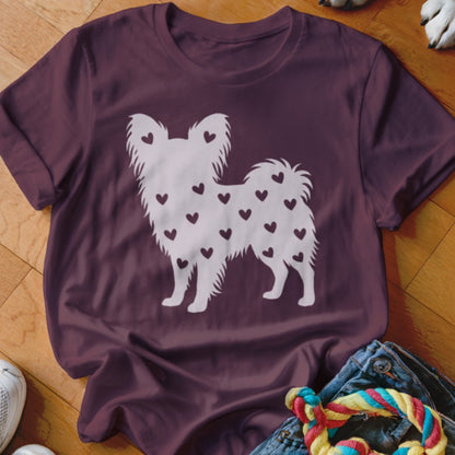 Maroon t-shirt with white silhouette of a fluffy dog covered in small hearts.