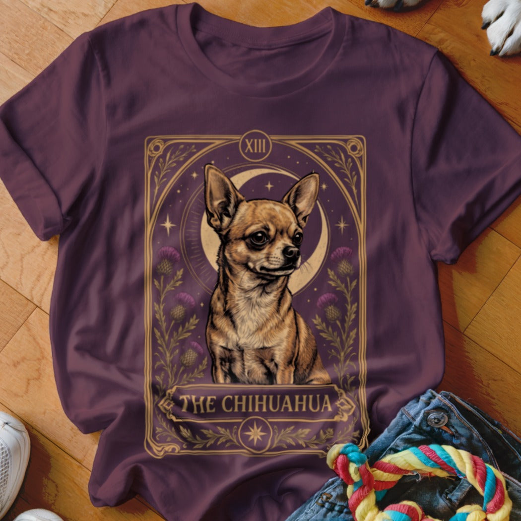 A dark purple t-shirt featuring a tarot card graphic of a Chihuahua with the text The Chihuahua.