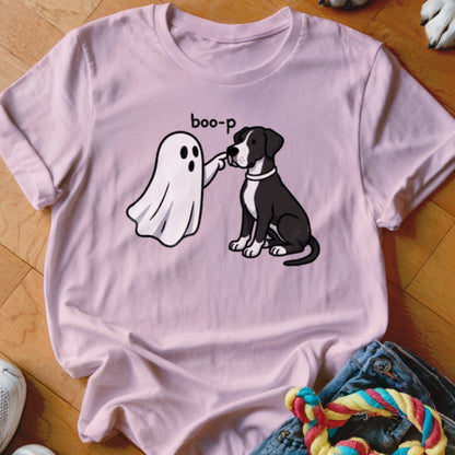 Pink t-shirt with illustration of a ghost booping a black and white dog.