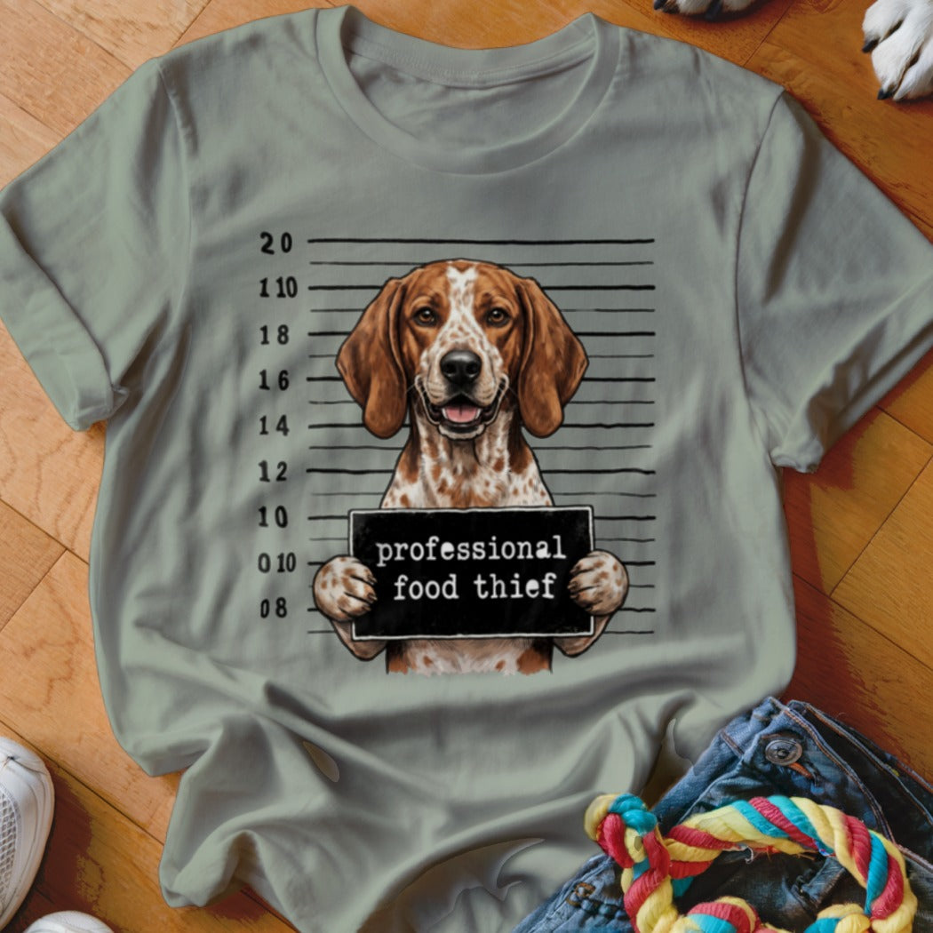 Dog mugshot with text "professional food thief".