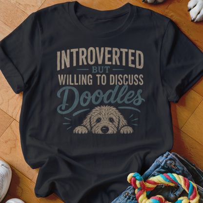 Black t-shirt with "Introverted But Willing To Discuss Doodles" text and a doodle dog illustration.
