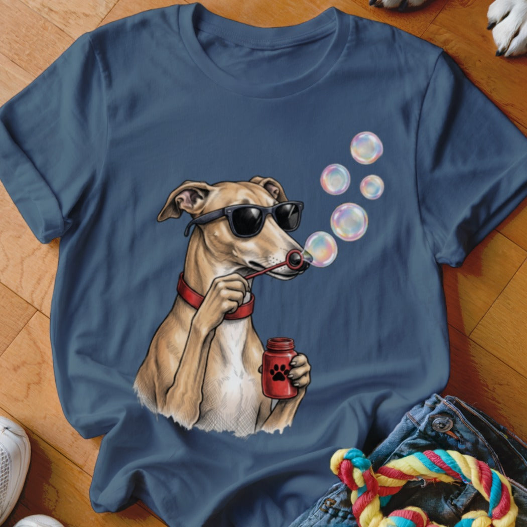 A blue t-shirt featuring an illustration of a dog wearing sunglasses and blowing bubbles.
