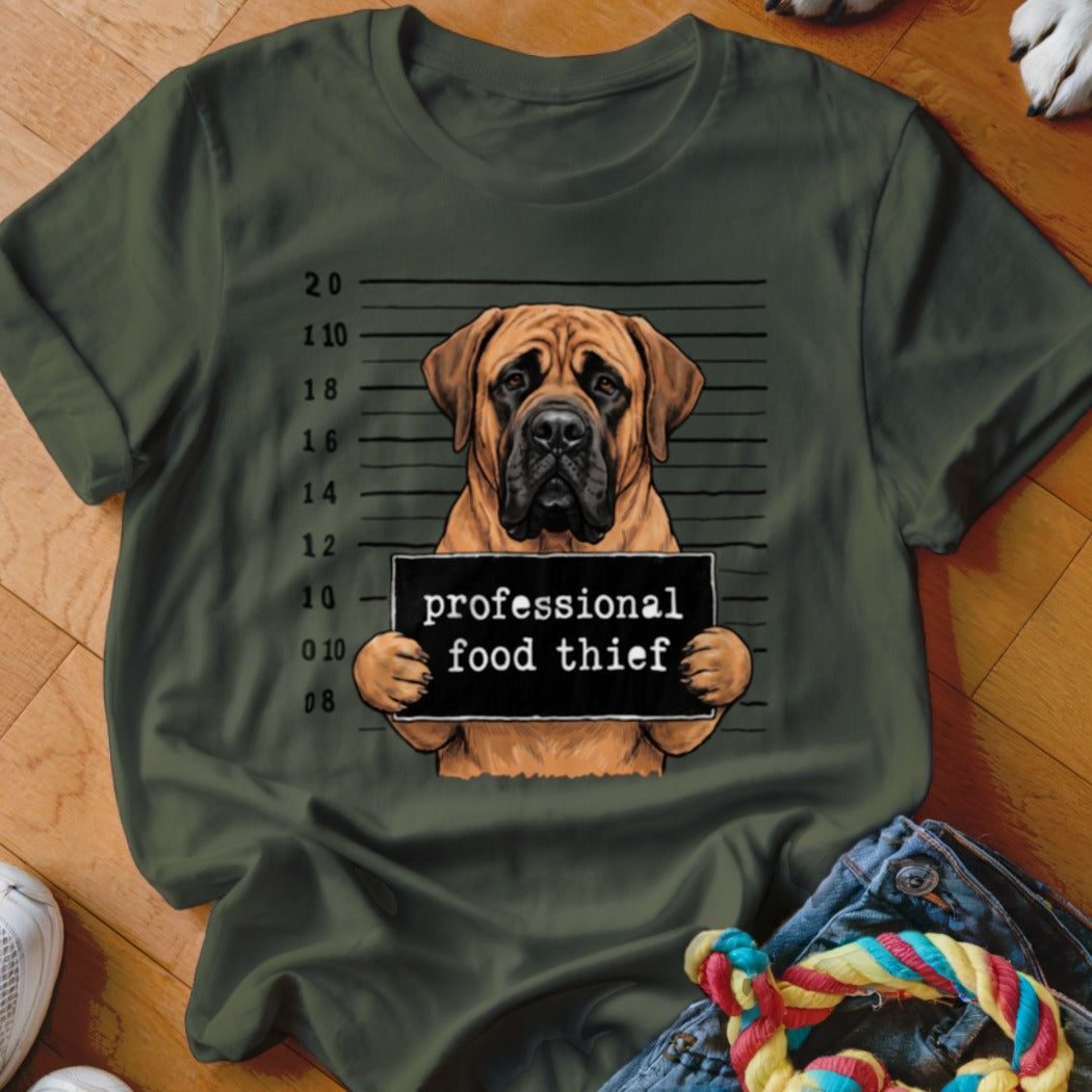 Mastiff dog with mugshot sign reading "professional food thief"