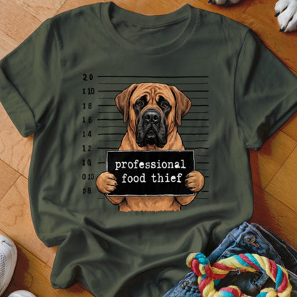 Mastiff dog with mugshot sign reading "professional food thief"