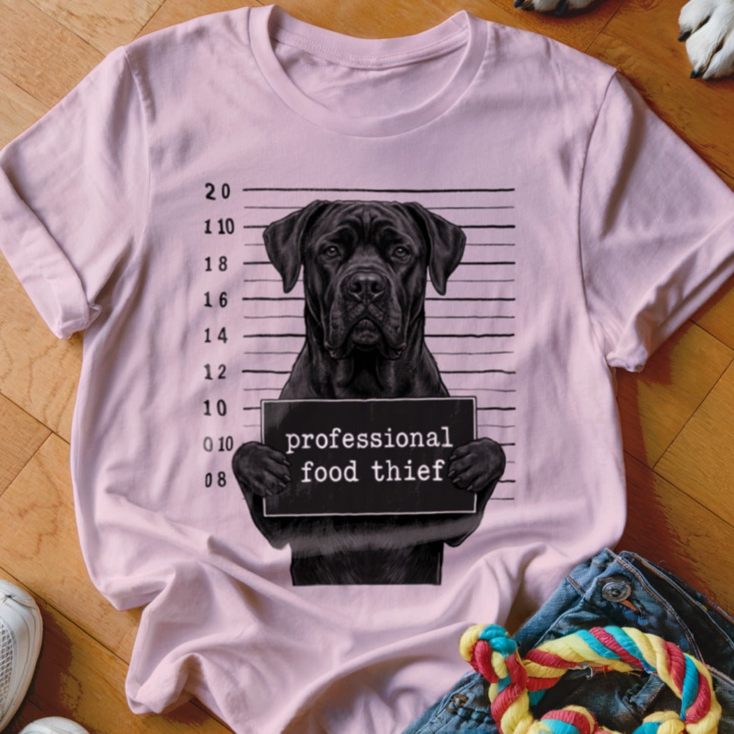 Pink t-shirt with black dog mugshot reading "professional food thief".