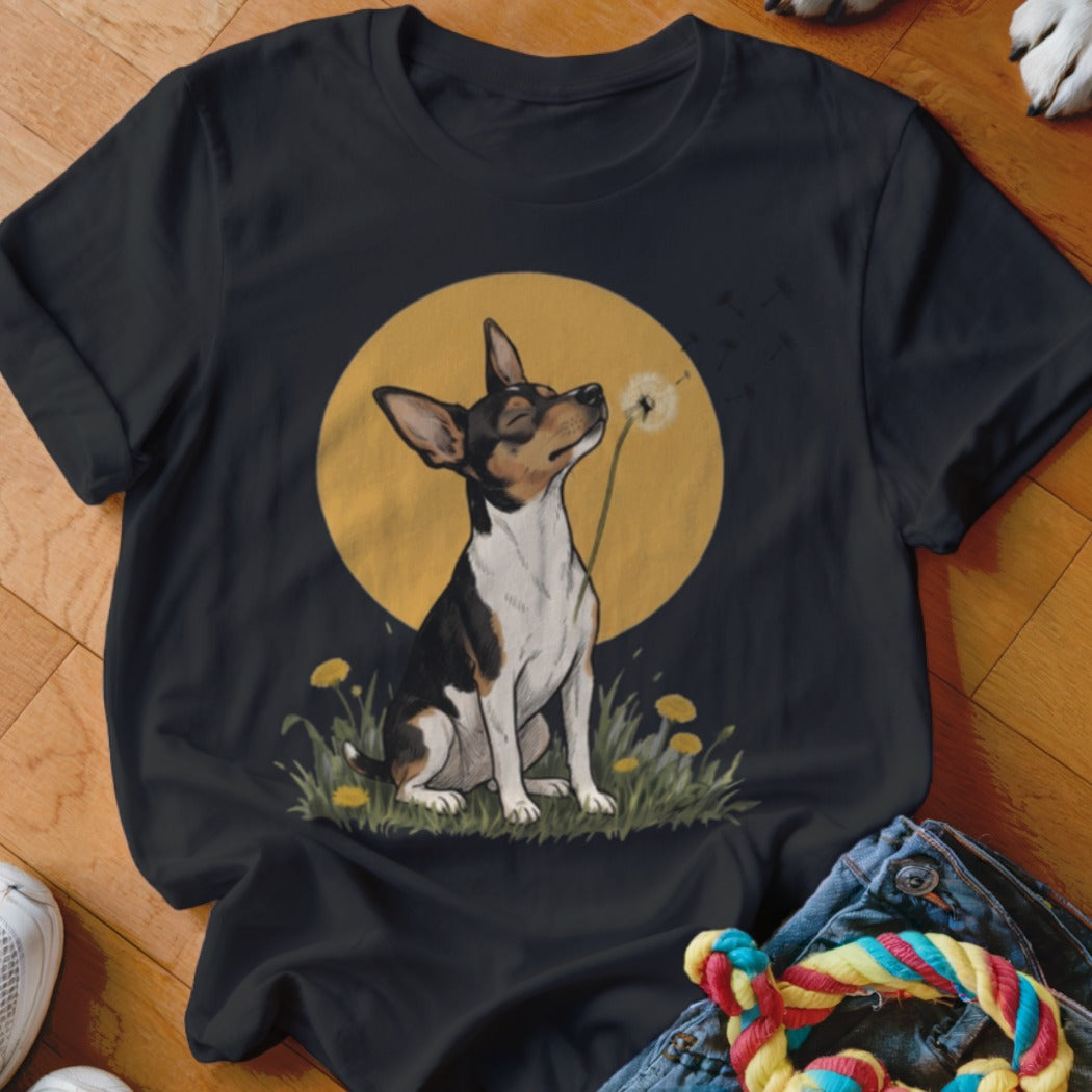 A black crewneck t-shirt featuring a graphic of a dog blowing a dandelion against a yellow moon background.