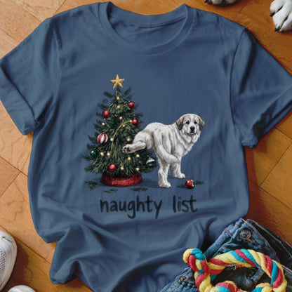 A blue t-shirt printed with a dog peeing on a Christmas tree and the text naughty list.