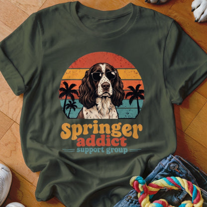 Dark green t-shirt with a vintage-style graphic of an English Springer Spaniel wearing sunglasses against a sunset.