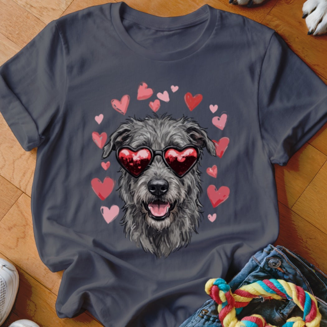 A dark gray t-shirt features a graphic of a scruffy gray dog wearing heart-shaped sunglasses, surrounded by pink and red hearts.
