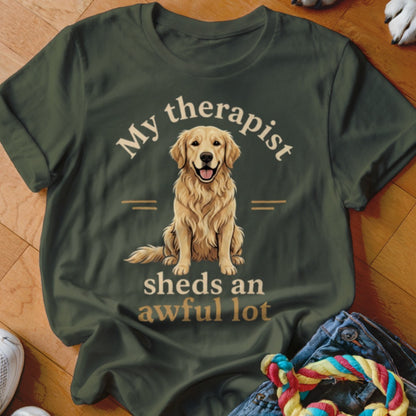 Green t-shirt with golden retriever graphic and text: "My therapist sheds an awful lot."