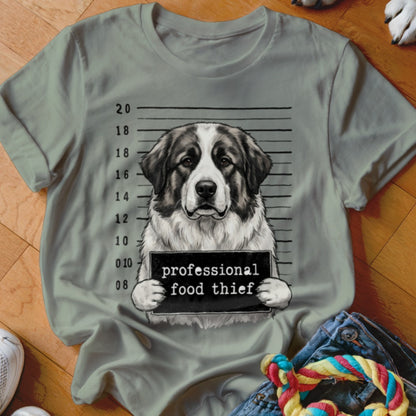Dog mugshot with "professional food thief" sign.