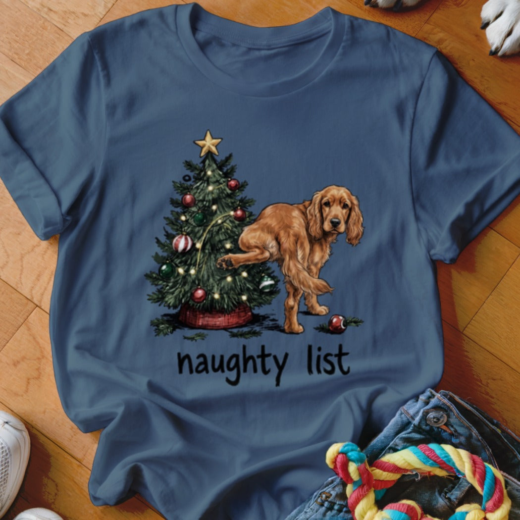 Brown dog by Christmas tree with text "naughty list"