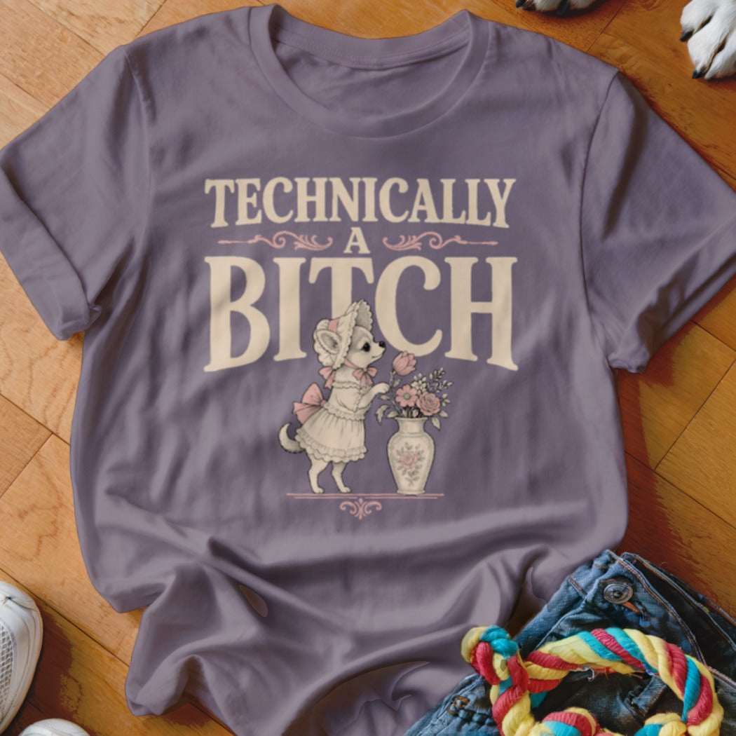 Purple t-shirt with "TECHNICALLY A BITCH" text and a dog in a dress with flowers.