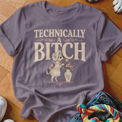 Purple t-shirt with "TECHNICALLY A BITCH" text and a dog in a dress with flowers.