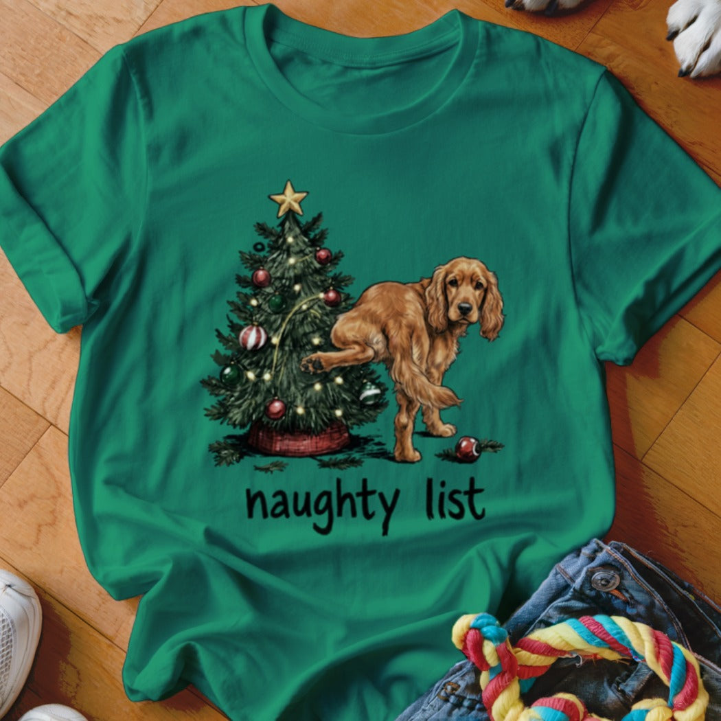 Golden retriever dog lifts leg on Christmas tree with text "naughty list".