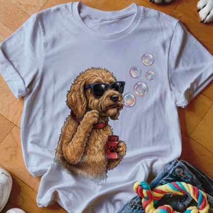 White crewneck t-shirt featuring a graphic of a fluffy brown dog wearing sunglasses and blowing bubbles.