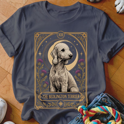 A dark grey t-shirt featuring a tarot card graphic of a Bedlington Terrier with moon and thistles.