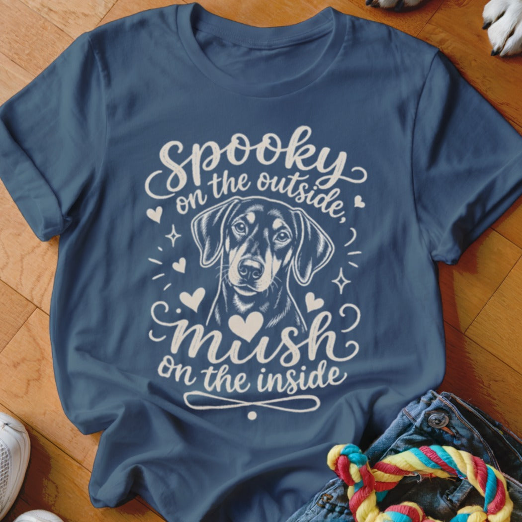 Blue t-shirt with dog illustration and text "Spooky on the outside, mush on the inside".