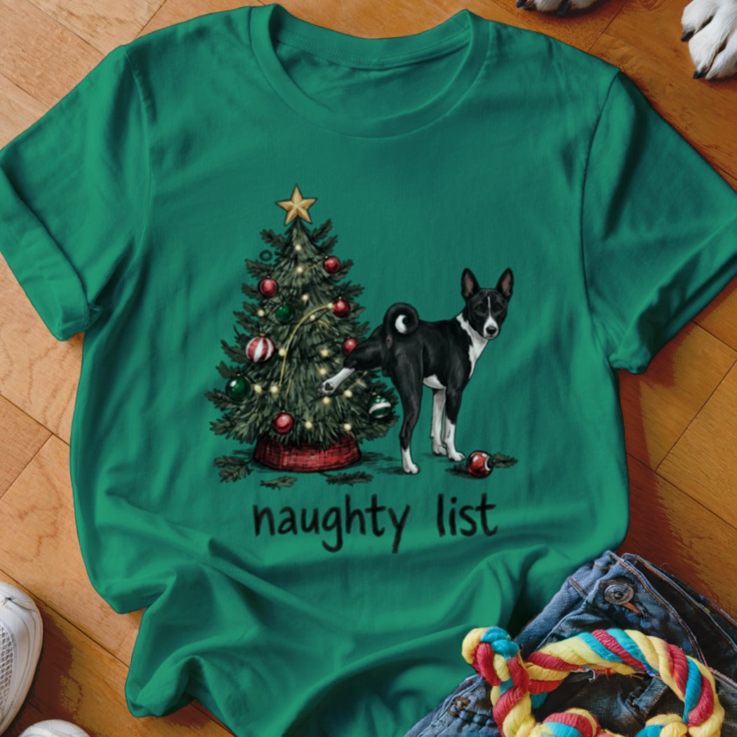 Green t-shirt featuring a graphic of a black and white dog urinating on a Christmas tree with the text naughty list underneath.