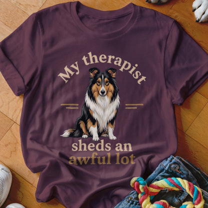 T-shirt with a sitting collie dog illustration and text "My therapist sheds an awful lot".