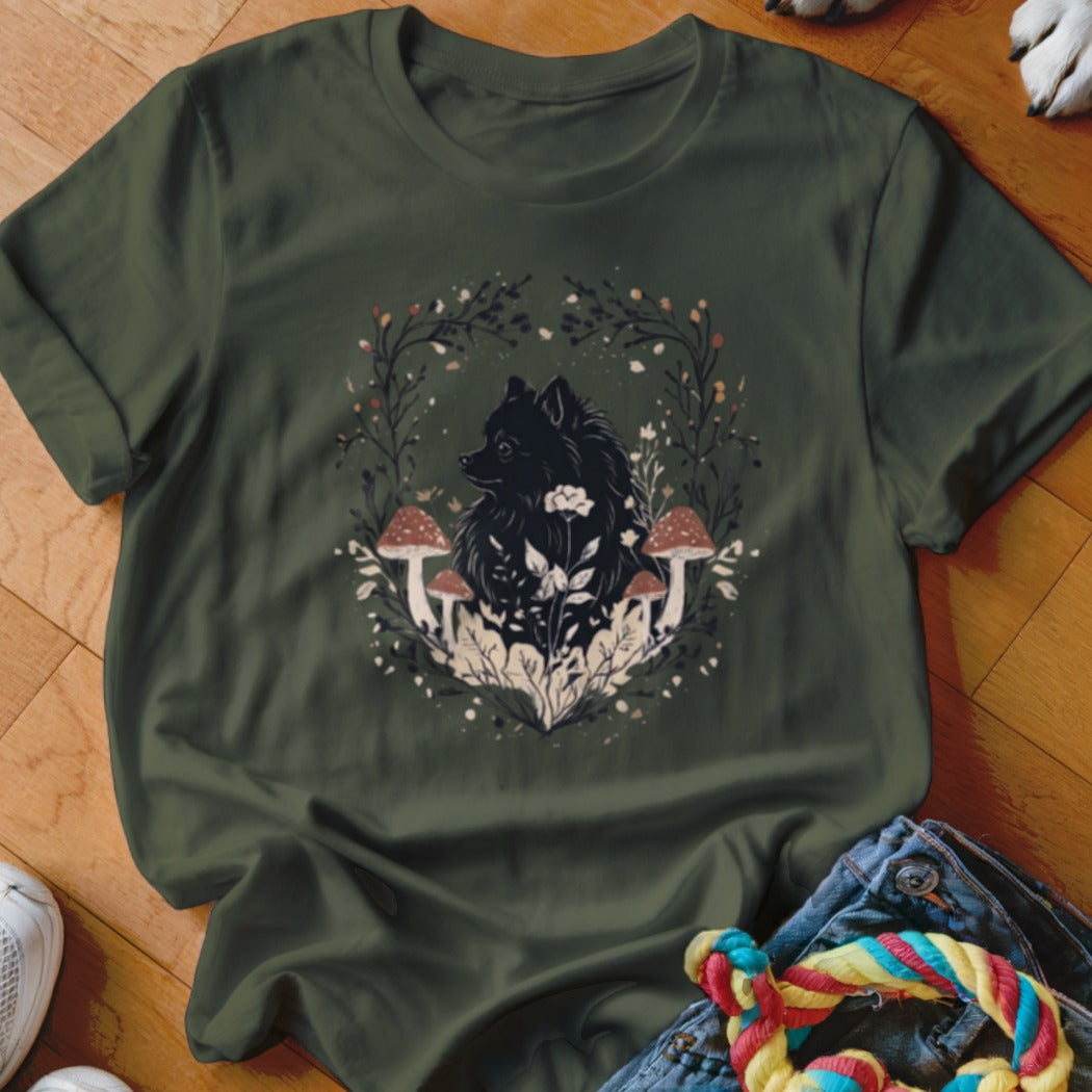 Dark green t-shirt featuring a graphic of a black dog surrounded by mushrooms and foliage.