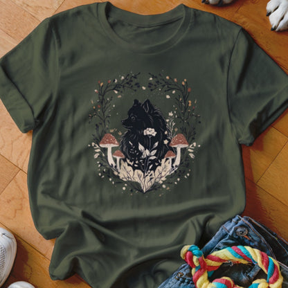 Dark green t-shirt featuring a graphic of a black dog surrounded by mushrooms and foliage.