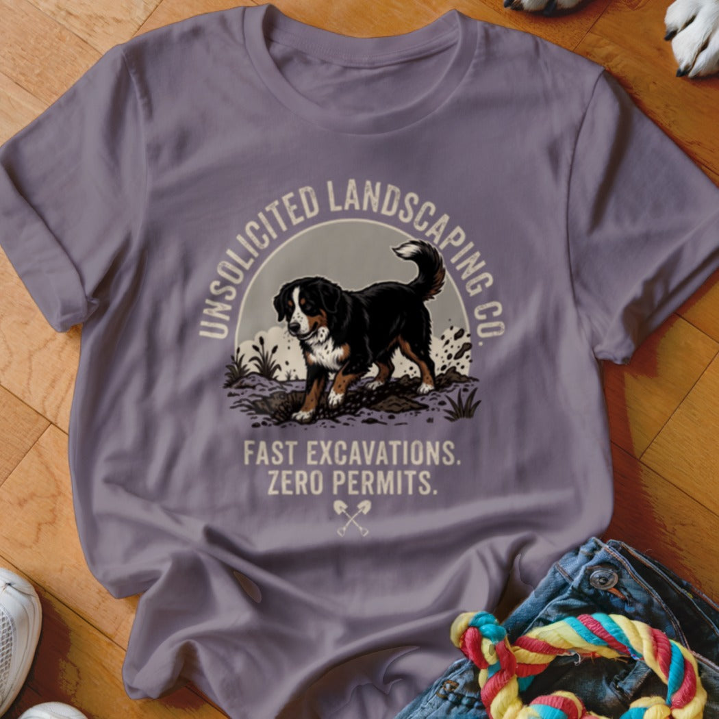 T-shirt with Bernese mountain dog digging, text "Unsolicited Landscaping Co. Fast Excavations. Zero Permits."