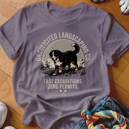 T-shirt with Bernese mountain dog digging, text "Unsolicited Landscaping Co. Fast Excavations. Zero Permits."
