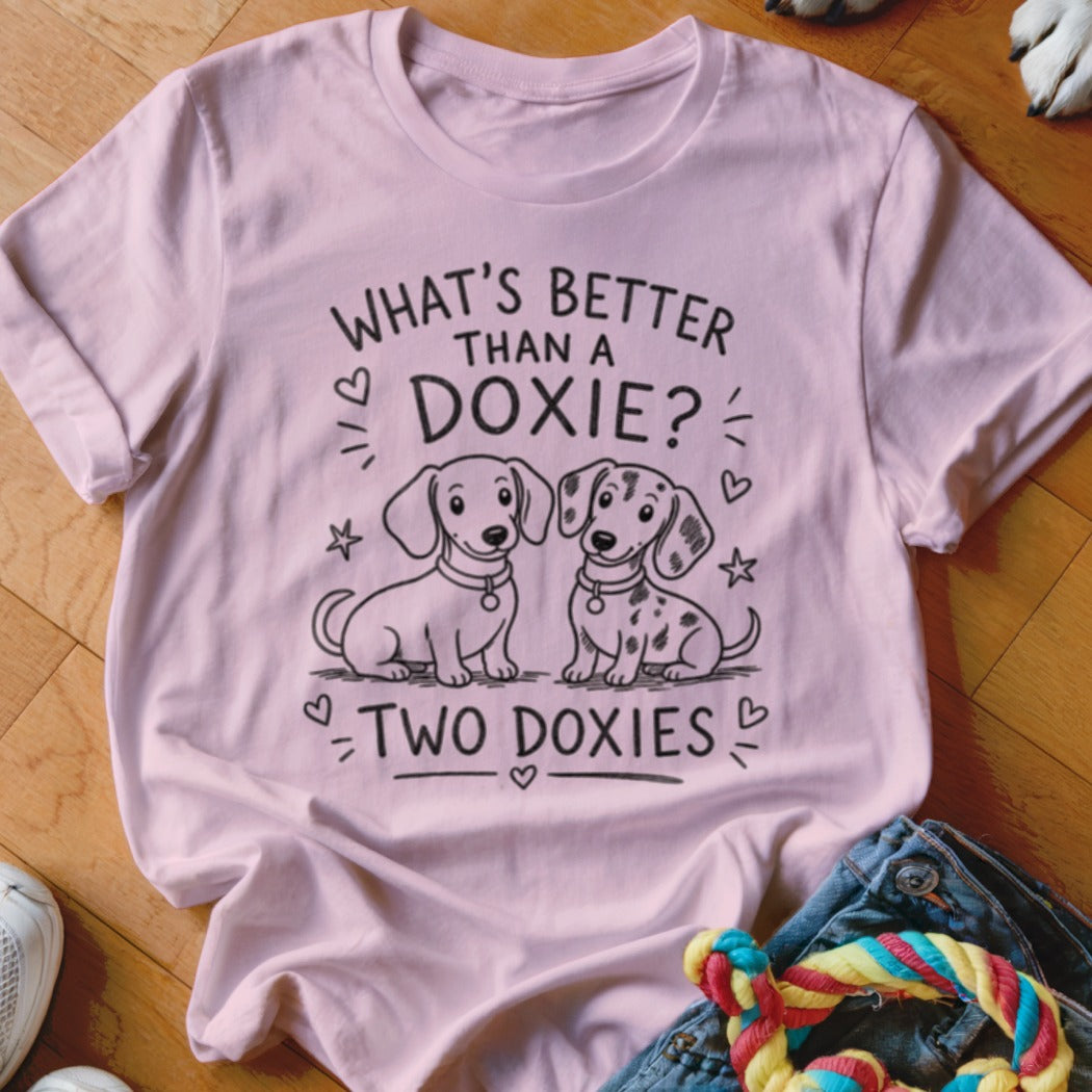Pink t-shirt with two dachshund puppies and text "What's Better Than a Doxie? Two Doxies".