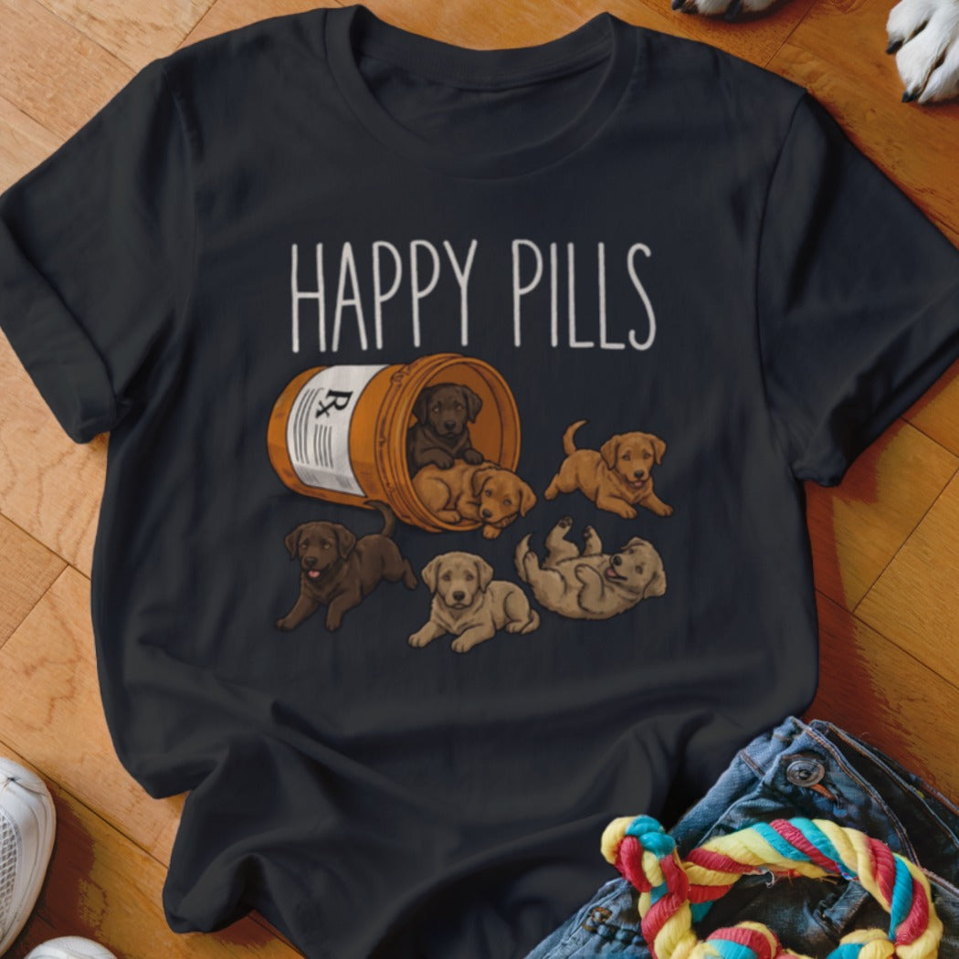T-shirt with "Happy Pills" text and puppies spilling from a pill bottle.