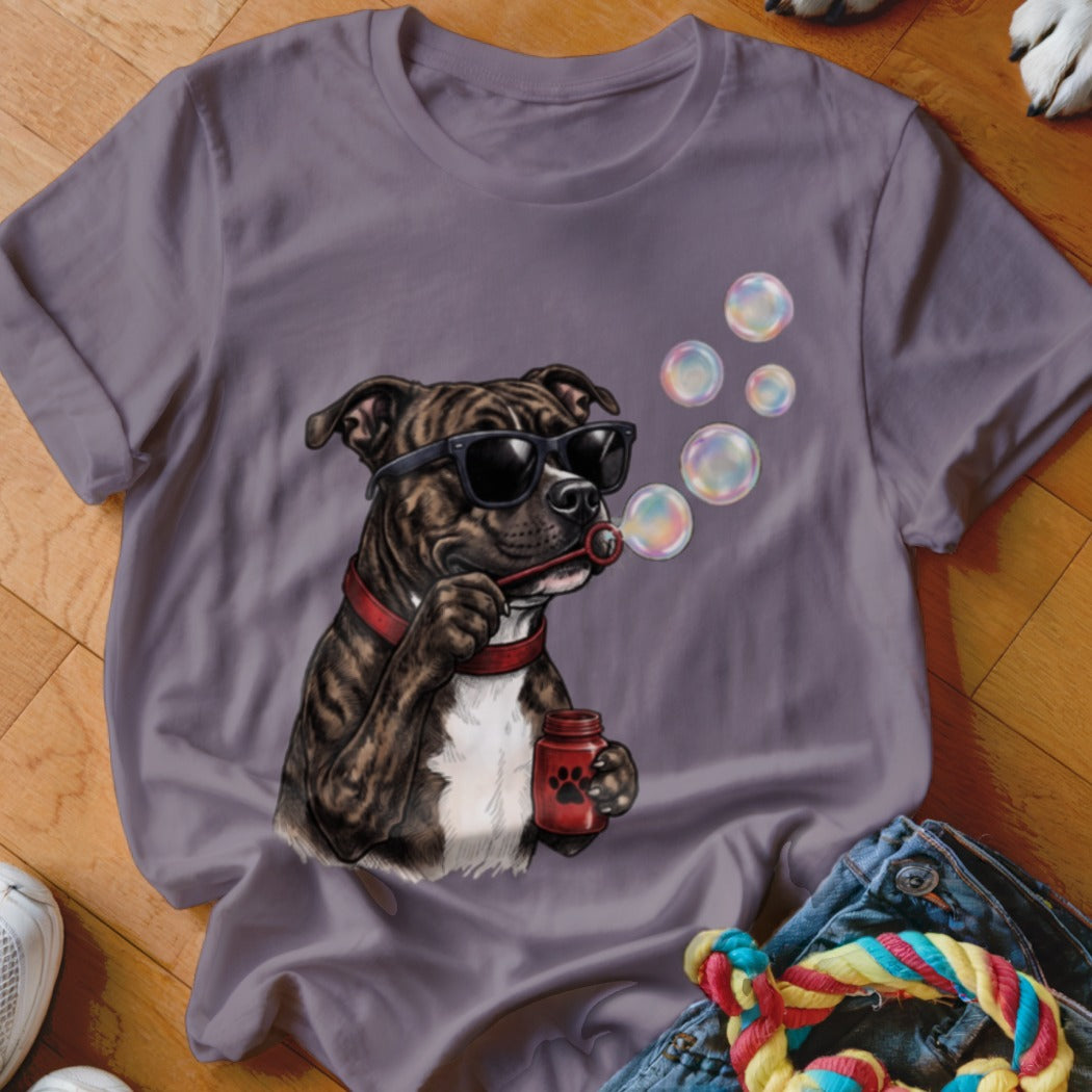 Grey short-sleeved t-shirt featuring an illustration of a brindle pit bull wearing sunglasses and blowing soap bubbles.