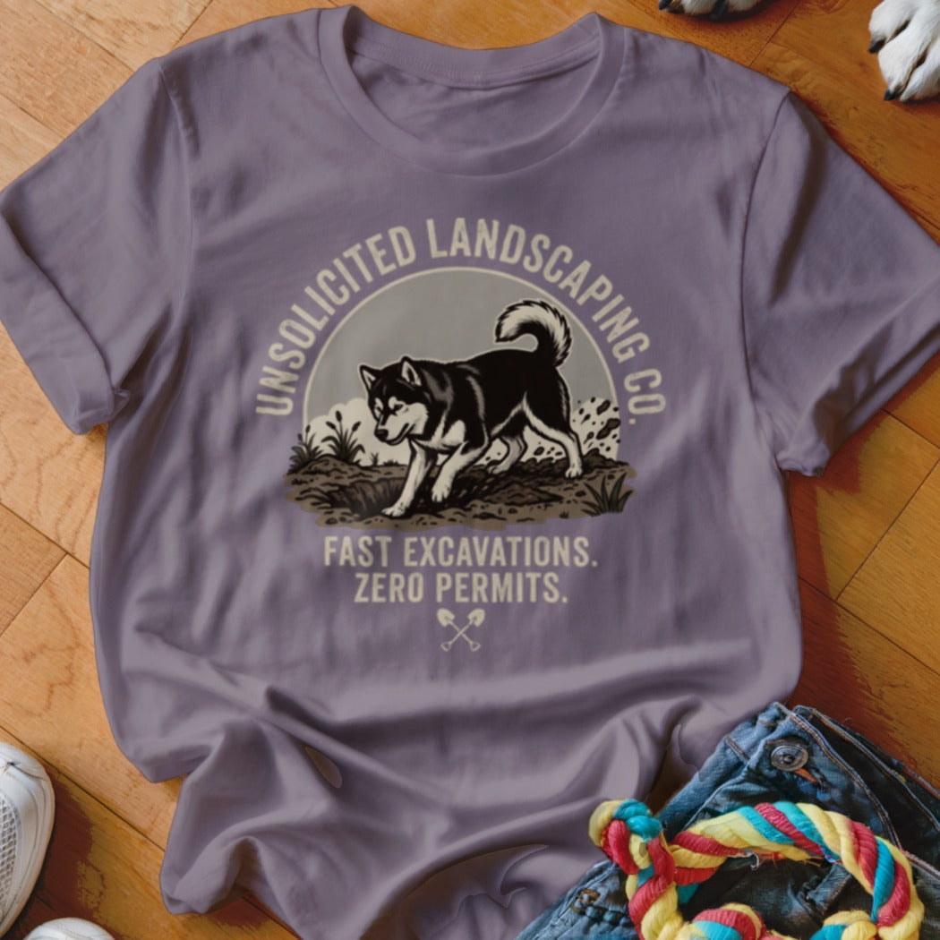 T-shirt graphic: Husky digging with text "Unsolicited Landscaping Co."