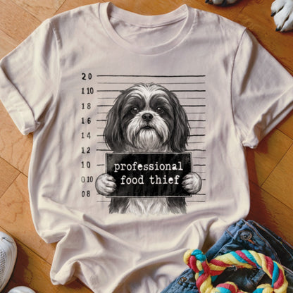 T-shirt graphic of a shih tzu dog with a "professional food thief" sign.