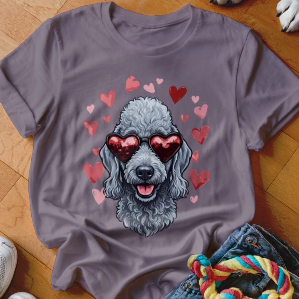A gray t-shirt features a graphic of a poodle wearing heart-shaped sunglasses, surrounded by pink hearts.