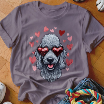 A gray t-shirt features a graphic of a poodle wearing heart-shaped sunglasses, surrounded by pink hearts.