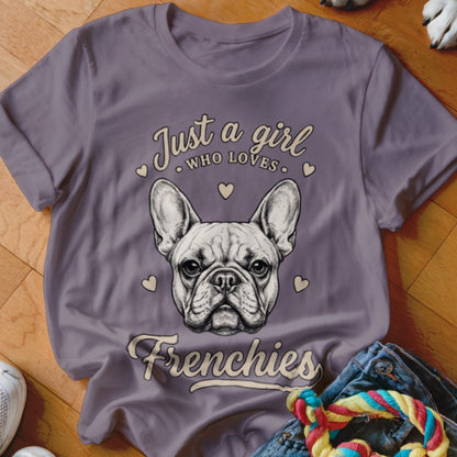A gray t-shirt with a graphic of a French Bulldog and the text Just a girl who loves Frenchies.