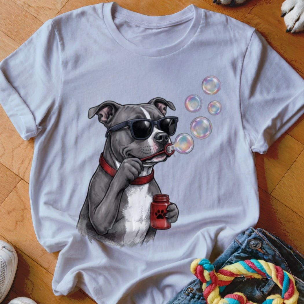 A white short-sleeved t-shirt featuring a graphic of a pit bull wearing sunglasses and blowing bubbles.
