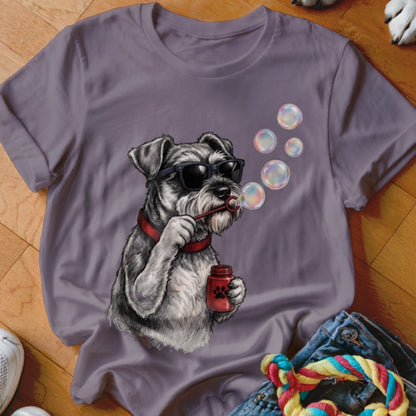 A purple t-shirt featuring a graphic of a schnauzer wearing sunglasses and blowing bubbles.