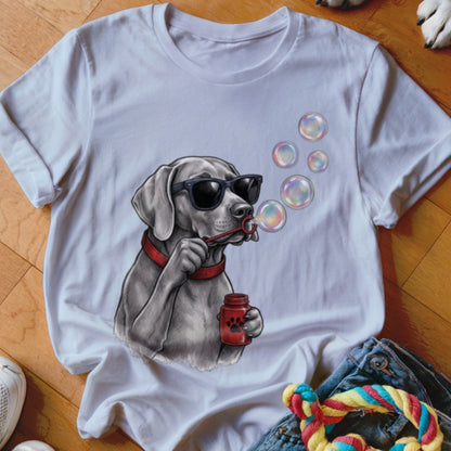 White t-shirt featuring a graphic of a gray dog wearing sunglasses and blowing bubbles.