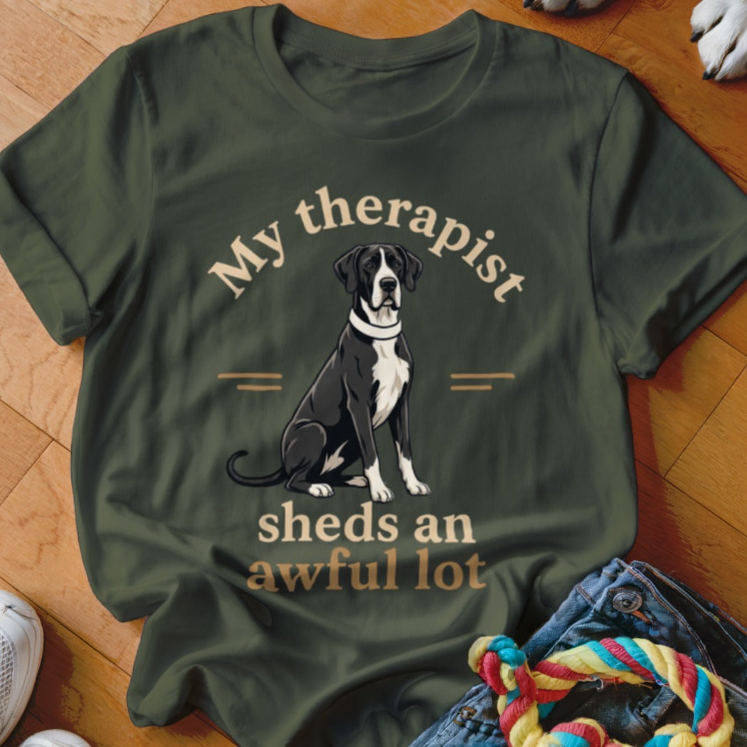 Great Dane graphic with text "My therapist sheds an awful lot" on a green t-shirt.