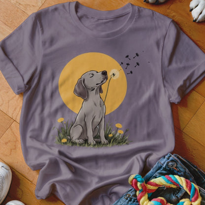 A purple t-shirt featuring a graphic of a grey dog blowing dandelion seeds against a yellow circle background.