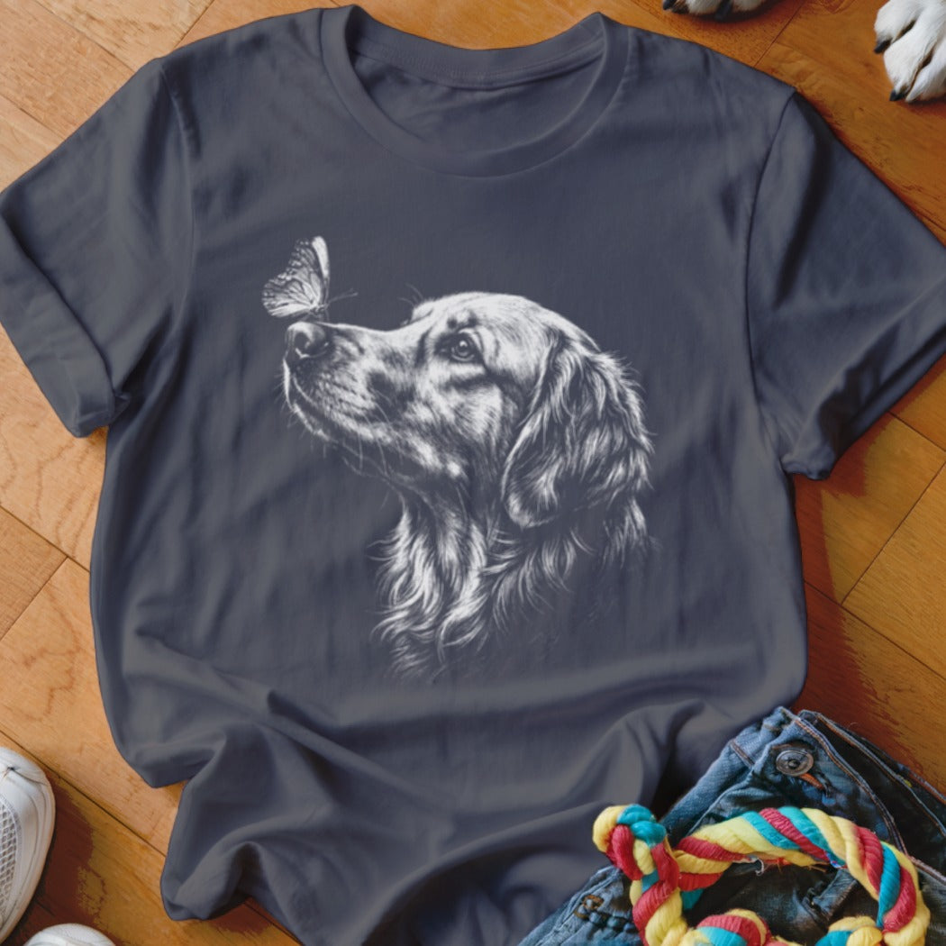 Dark grey t-shirt featuring a white sketched graphic of a golden retriever looking at a butterfly.