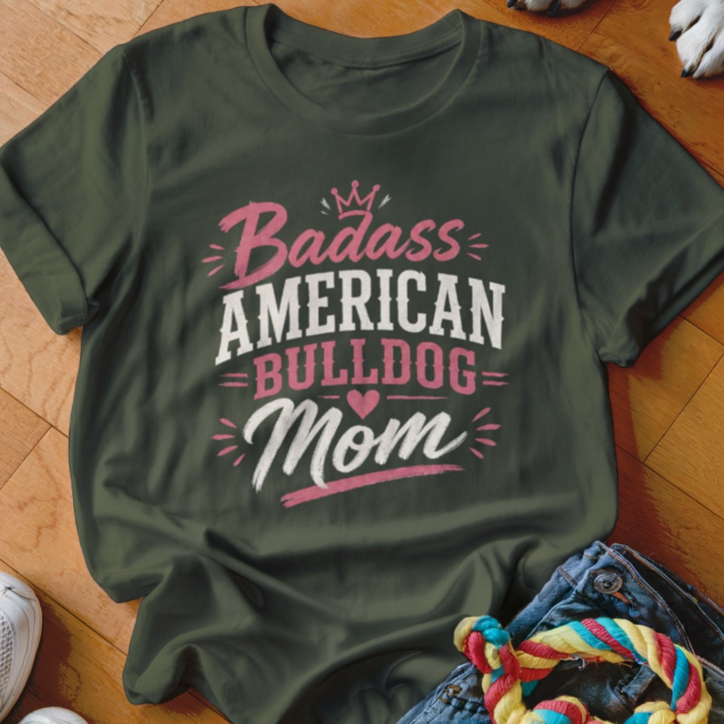 Green t-shirt with text "Badass American Bulldog Mom" in pink and white.