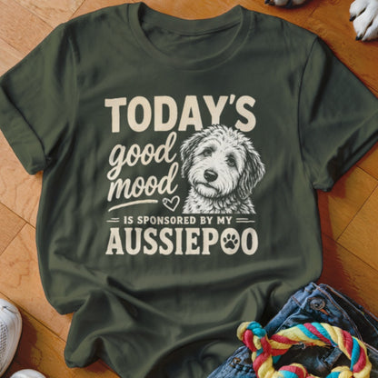 Green t-shirt with white text "Today's good mood is sponsored by my Aussiepoo" and dog illustration.