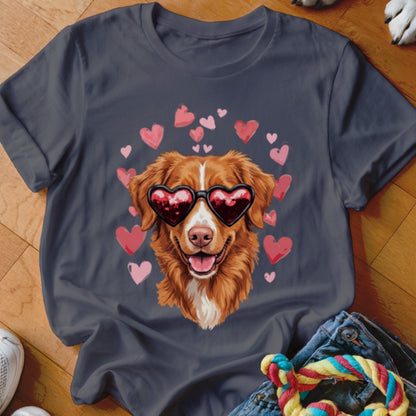 Dark gray t-shirt featuring a graphic of a golden dog wearing heart-shaped sunglasses surrounded by pink hearts.