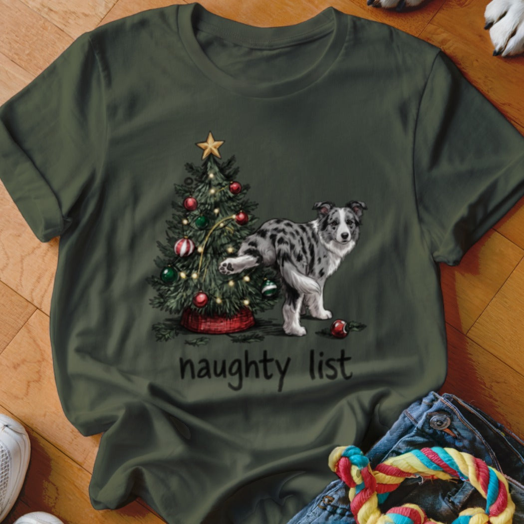 Green t-shirt with a Border Collie beside a Christmas tree, reading "naughty list".