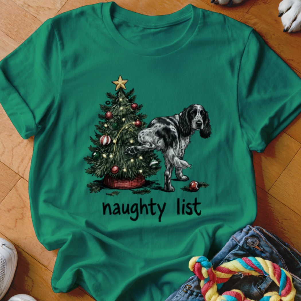 Green t-shirt with a Christmas tree and a dog with the text "naughty list".