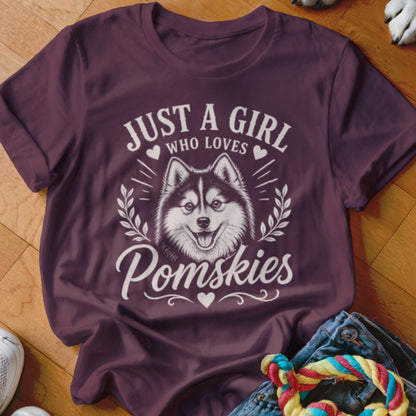 Maroon t-shirt with "Just a girl who loves Pomskies" text and a Pomsky dog illustration.
