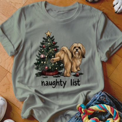 Golden dog near Christmas tree with "naughty list" text.