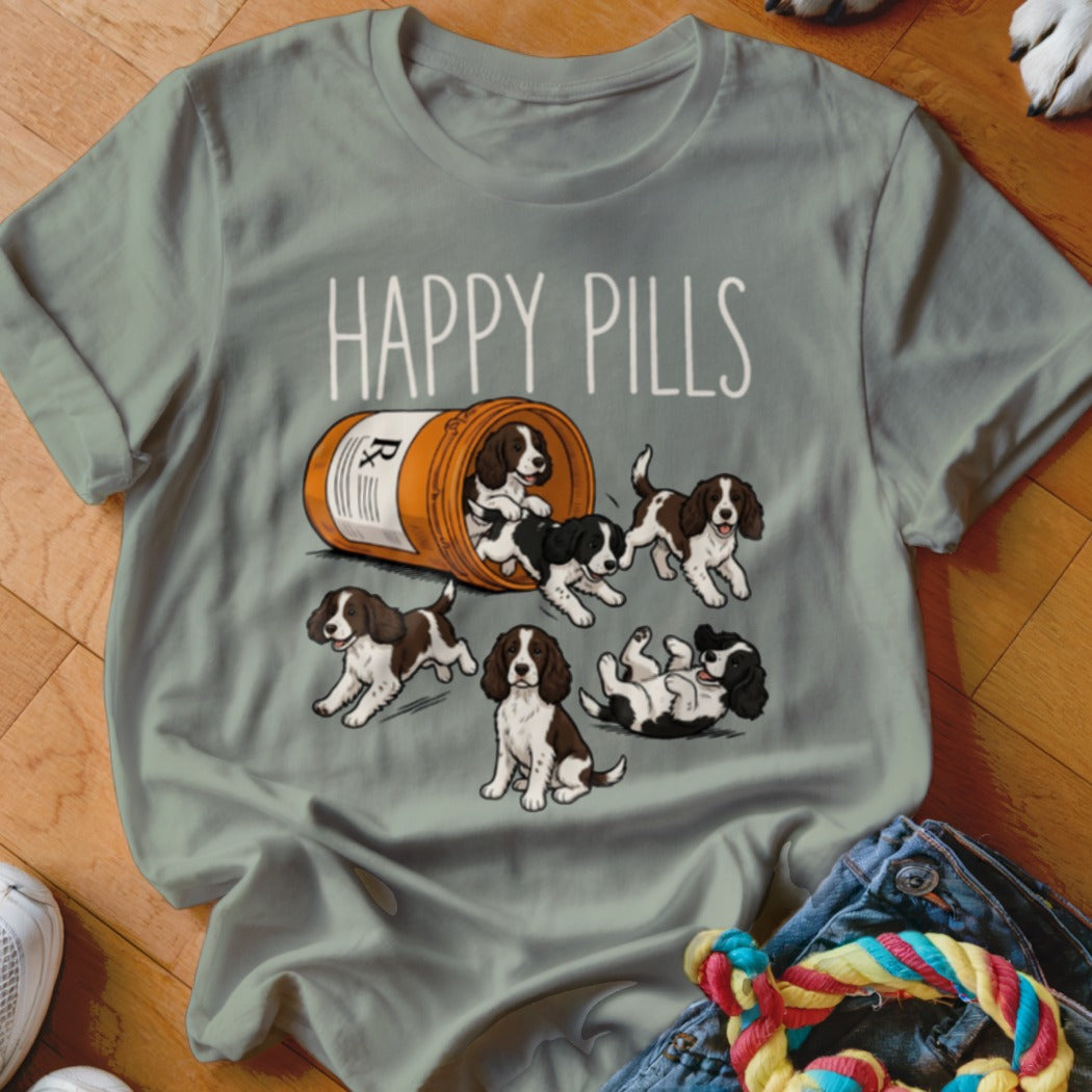 Brown and white puppies spill from a prescription bottle with "HAPPY PILLS" text.